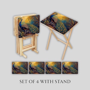 May include: A set of four wooden TV trays with a peacock design. The trays have a light wood frame and a colorful peacock image on the tabletop. The set includes a stand for storage. The text "SET OF 4 WITH STAND" is at the bottom.