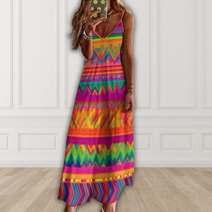 May include: A vibrant, floor-length dress with a V-neck and spaghetti straps. The dress features a colorful geometric pattern in shades of orange, pink, yellow, green, and blue. The design includes chevron and horizontal stripe elements, creating a bold and eye-catching look.