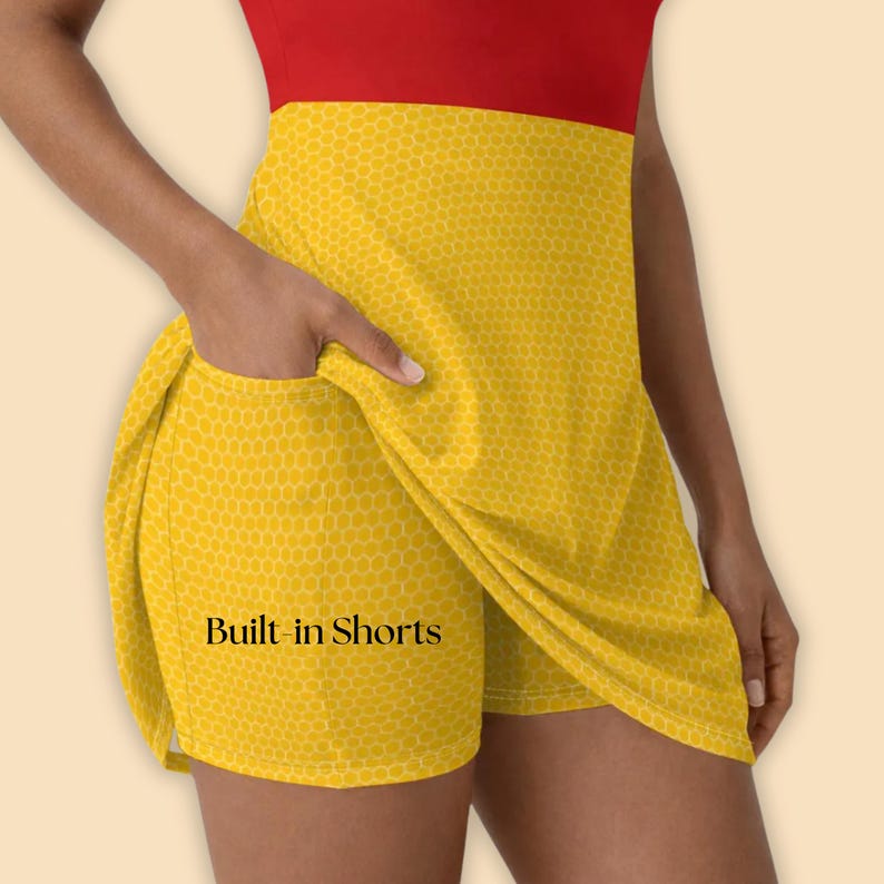 May include: A sleeveless dress with built-in shorts. The top is red, and the skirt is yellow with a honeycomb pattern. The text "Built-in Shorts" is visible on the shorts.