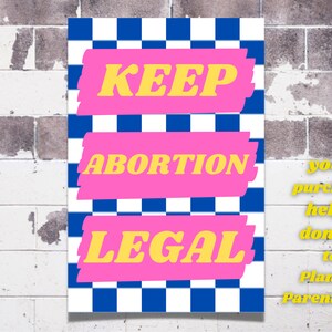 May include: A pink and blue checkered poster with the text "KEEP ABORTION LEGAL" in yellow letters. The text "your purchase helps donate to Planned Parenthood!" is written in white text on the right side of the poster.