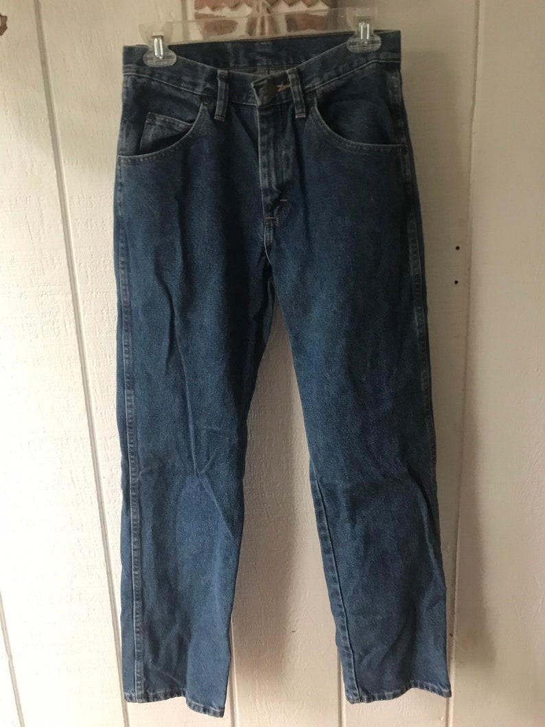 May include: A pair of blue denim jeans with a straight leg fit.