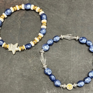 May include: A rustic wooden sign with the text "Welcome to our home" in white lettering. The sign features a distressed finish and a simple, inviting design, perfect for entryway decor.