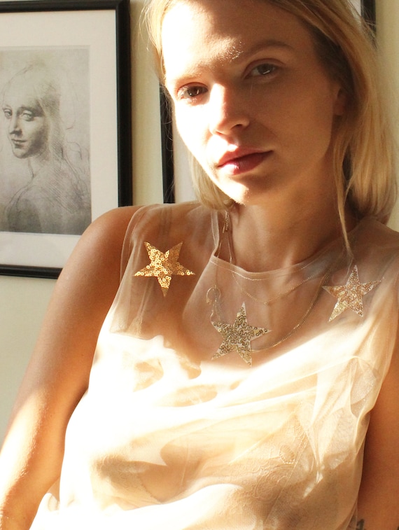 white sheer top with stars