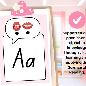 May include: A pink and white educational poster featuring the letter "Aa" with a speech bubble showing lips. The poster is held by a wooden clipboard and has the text "Support student phonics and alphabet knowledge through visual learning and applying the Science of Reading."