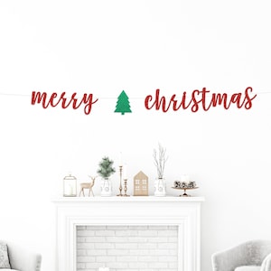 May include: A red and green Christmas banner with the words "merry christmas" and a green glitter Christmas tree in between the words.