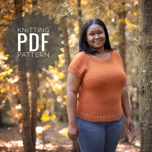 May include: A woman wearing a knitted orange top with short sleeves, standing in a forest setting. The text "Knitting PDF Pattern" is superimposed on the image.