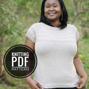 May include: A beige knitted top with short sleeves. The top has a textured design across the chest and around the sleeves. The image includes a circular graphic that reads "KNITTING PDF PATTERN".