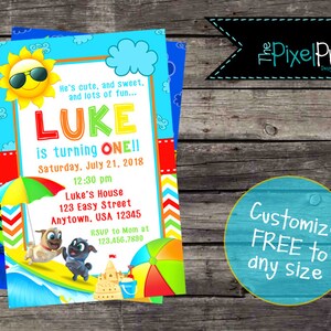 May include: A colorful birthday invitation for a boy named Luke turning one. The invitation features a cartoon sun wearing sunglasses, a beach scene with a sandcastle, a beach umbrella, and two cartoon dogs. The text on the invitation reads "He's cute, and sweet, and lots of fun... Luke is turning one!! Saturday, July 21, 2018 12:30 pm Luke's House 123 Easy Street Anytown, USA 12345 RSVP to Mom at 123.456.7890"