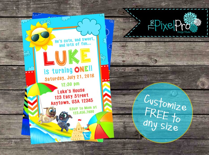 May include: A colorful birthday invitation for a boy named Luke turning one. The invitation features a cartoon sun wearing sunglasses, a beach scene with a sandcastle, a beach umbrella, and two cartoon dogs. The text on the invitation reads "He's cute, and sweet, and lots of fun... Luke is turning one!! Saturday, July 21, 2018 12:30 pm Luke's House 123 Easy Street Anytown, USA 12345 RSVP to Mom at 123.456.7890"