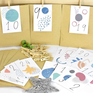 Advent calendar DIY with paper bags, numbers and wooden clips with motifs