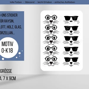 Könnte beinhalten: Ein Bogen Rub-On-Aufkleber mit schwarz-weißen Katzen-Gesichtern mit Brillen und Sonnenbrillen. Die Aufkleber sind ca. 7 x 9 cm groß. Auf dem Bogen steht "RUB-ONS STICKER" und "MOTIV 0-K18".