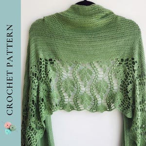 May include: A green crochet shawl with a leaf pattern. The shawl is displayed on a hanger against a white background. The text "CROCHET PATTERN" is printed vertically on the left side of the image.