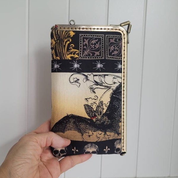 Halloween spooky wallet/phone case/spectacle case with card slots.  Bat and crawling beetle print.    Kisslock metal frame knob clasp.