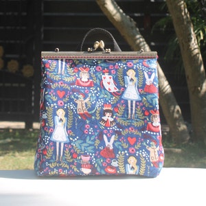 Alice in wonderland kiss lock convertible backpack or crossbody or shoulder-bag with metal knob clasp opening