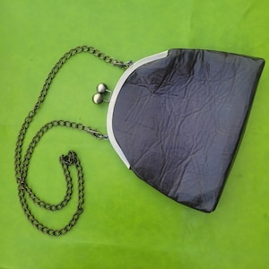 Soft dark brown leather crossbody with metal frame kiss lock and antique brass chain