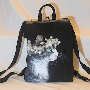 Hand painted Cat backpack / school bag. Floral crowned black cat on black ground. Kiss lock metal frame clasp opening. Personalised & unique