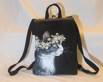 Hand painted Cat backpack / school bag. Floral crowned black cat on black ground. Kiss lock metal frame clasp opening. Personalised & unique