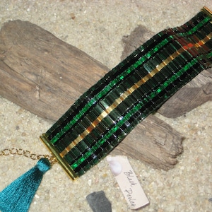 Bracelet cuff weaved green black gold Miyuki Tila beads Green pompom