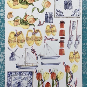 Immagini olandesi per la lavorazione della carta, tra cui tulipani, scarpe di legno e ceramica blu di Delft