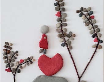 Pebble Art – Woman in Red Dress on Heart-Shaped Rock