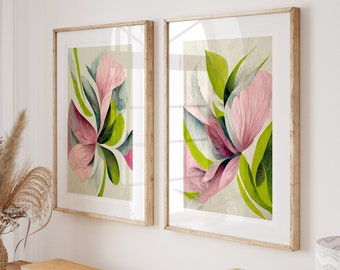 May include: Two framed floral prints with pink and green abstract flowers on a light beige background. The prints are hanging on a white wall above a wooden console table with books and a vase of dried flowers.
