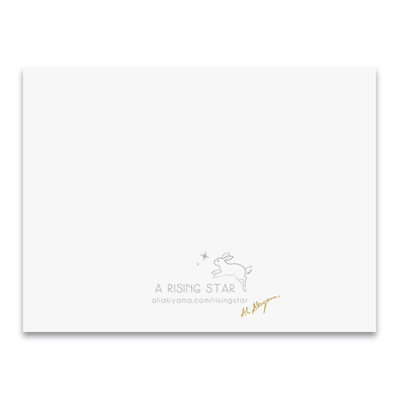 May include: A white card with a gray line drawing of a rabbit jumping with stars. The text "A RISING STAR" and the website address "allakiyama.com/risingstar" are printed in gray. The text "Ai Akiyama" is written in gold cursive.