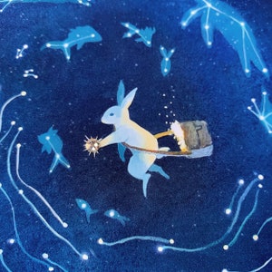 May include: A white rabbit with blue accents is flying through a dark blue sky with white stars. The rabbit is holding a small, round, gold object in its paw and pulling a brown bucket behind it.