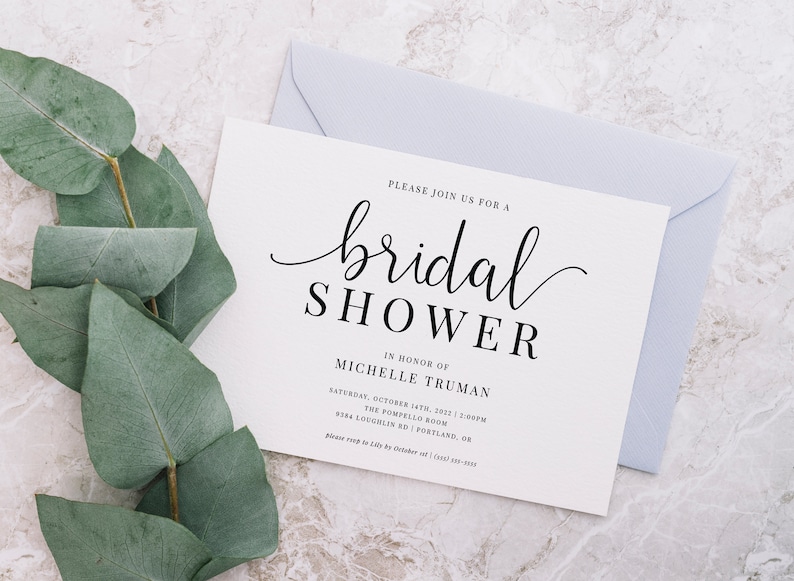 May include: A white bridal shower invitation with black text. The invitation reads "Please join us for a bridal shower in honor of Michelle Truman. Saturday, October 14th, 2022 | 2:00PM The Pompello Room 9384 Loughlin Rd | Portland, OR Please RSVP by October 1st | (555) 555-5555"
