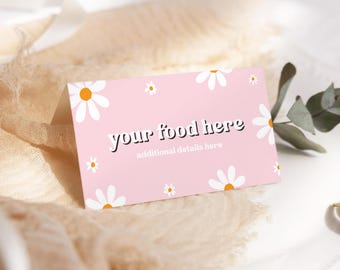May include: Pink card with white daisies and the text "your food here" and "additional details here" in black.