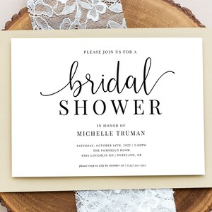 May include: A white bridal shower invitation with black text. The invitation reads "Please join us for a bridal shower in honor of Michelle Truman. Saturday, October 14th, 2022 at 2:00pm. The Pompello Room, 9384 Loughlin Rd, Portland, OR. Please RSVP to Lily by October 1st (503) 335-3053."