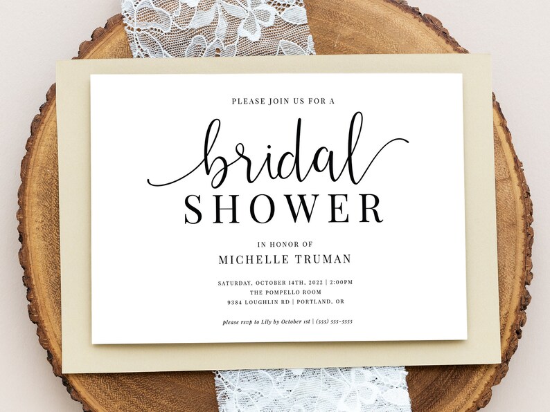 May include: A white bridal shower invitation with black text. The invitation reads "Please join us for a bridal shower in honor of Michelle Truman. Saturday, October 14th, 2022 at 2:00pm. The Pompello Room, 9384 Loughlin Rd, Portland, OR. Please RSVP to Lily by October 1st (503) 335-3053."