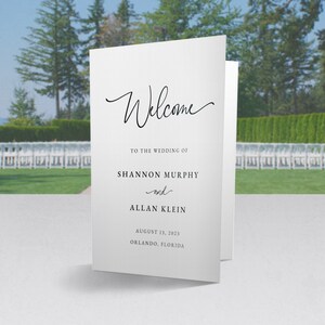 May include: A white wedding programme with black text. The text reads "Welcome to the wedding of Shannon Murphy and Allan Klein, August 13, 2023, Orlando, Florida."