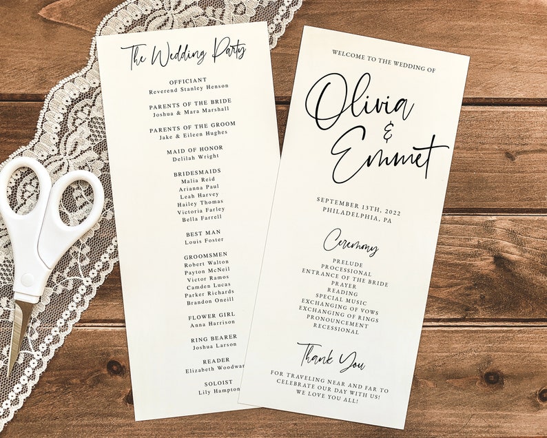 May include: Wedding ceremony program with black calligraphy text on white paper. The program lists the officiant, wedding party, and ceremony details. The program includes the names Olivia and Emmet and the date September 13th, 2022.
