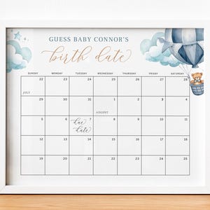 May include: A printable baby shower game with a blue and white watercolor design. The game asks guests to guess the baby's birth date. The due date is marked on the calendar as August 7th.