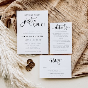 May include: Wedding invitation suite with white cardstock and black text. The invitation reads "Nothing Fancy, Just Love" and includes the names "Skylar & Owen" and the date "Sept 12 | 2022". The details card includes information about the ceremony and reception, parking, and accommodations. The RSVP card includes a section for guests to indicate their attendance and a space for the number of guests attending.