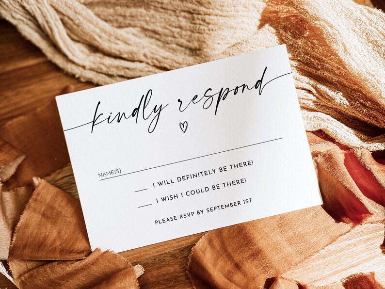 May include: White RSVP card with black text that reads "kindly respond" with a small heart symbol. The text below asks for the name(s) of the guest(s) and provides two options for responding: "I will definitely be there!" or "I wish I could be there!" The card also includes the instruction to RSVP by September 1st.
