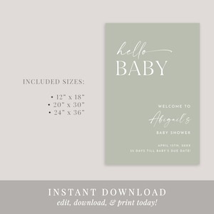 May include: A sage green printable baby shower sign with white text that reads "hello baby", "Welcome to Abigail's Baby Shower", "April 15th, 20XX", and "35 days till baby's due date".
