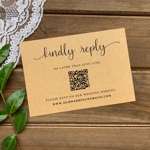 May include: A brown card with the text "kindly reply" in cursive script. The card also includes the text "No later than June 13th" and a QR code. The text "Please RSVP on our wedding website: www.ourweddingwebsite.com" is printed at the bottom of the card.