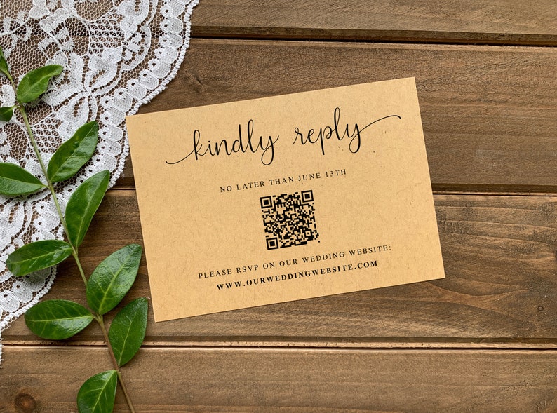 May include: A brown card with the text "kindly reply" in cursive script. The card also includes the text "No later than June 13th" and a QR code. The text "Please RSVP on our wedding website: www.ourweddingwebsite.com" is printed at the bottom of the card.