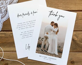 May include: A white thank you card with a black handwritten message that says "Thank you" and a photo of a couple in a field. The text at the bottom of the card says "Mr. & Mrs. Anderson 08.05.23".