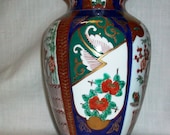 Listing 093 is the Colorful detailed hand painted Gold Imari Vase