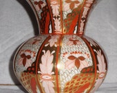 Imari style gold trimmed porcelain vase