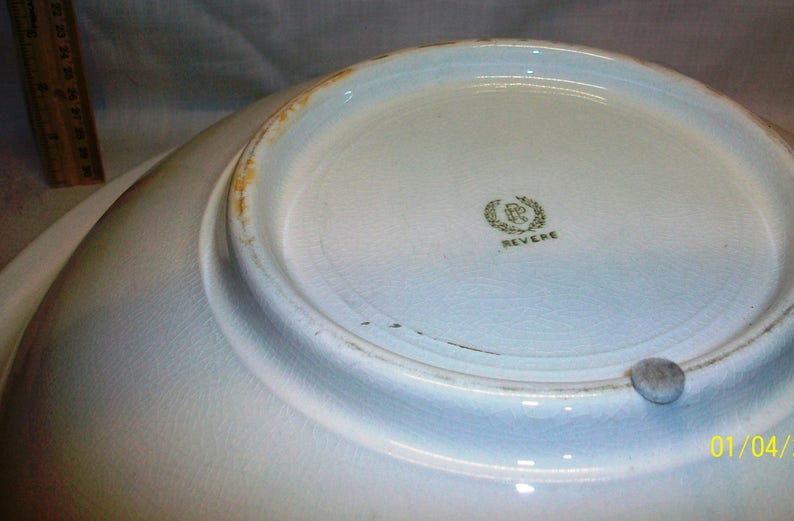 Listing 233 is the Revere Pottery White Floral Pitcher And Basin