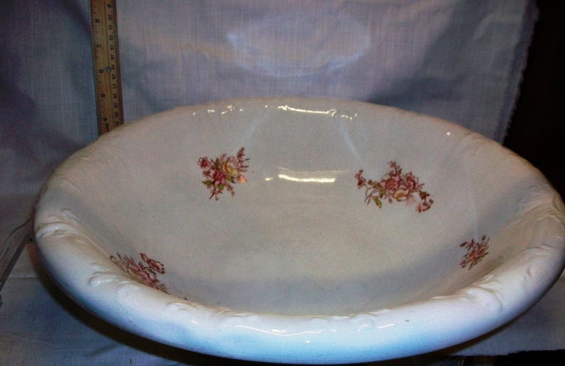 Listing 233 is the Revere Pottery White Floral Pitcher And Basin