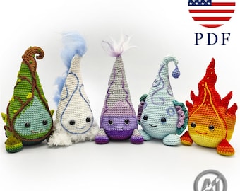 May include: Five crocheted plush figures in a row, each with a unique conical shape and embroidered facial features. The figures feature green, white, purple, light blue, and red-orange color schemes with varied textures and yarn details.