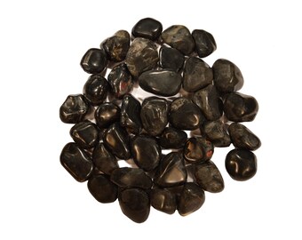 May include: A collection of smooth, black tumbled stones. The stones are of various sizes and shapes, and have a polished, glossy finish.