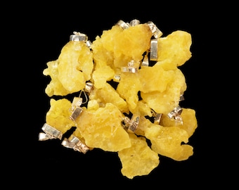 May include: A cluster of yellow, irregularly shaped, rough-textured stones with silver metal clasps. The stones are clustered together and appear to be natural.