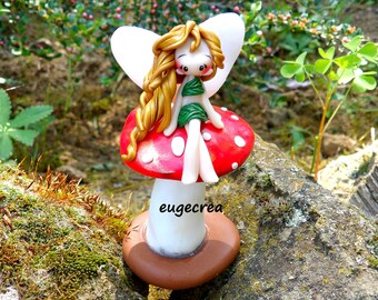 Miniature fairy on mushroom with polymer clay