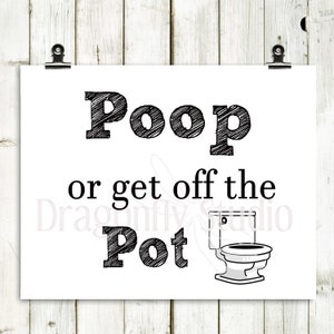May include: A white poster with the text "Poop or get off the Pot" in black, with a toilet illustration. The poster is held by two black clips against a white wooden background.