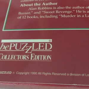 K&ouml;nnte beinhalten: Eine rote Box mit dem Text "bePUZZLED COLLECTORS EDITION" und den Copyright-Informationen "Copyright 1990 All Rights Reserved a division of Lo".